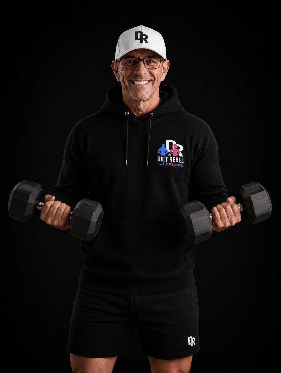 Brian Lee holding dumbbells — The Diet Rebel — muscle matters